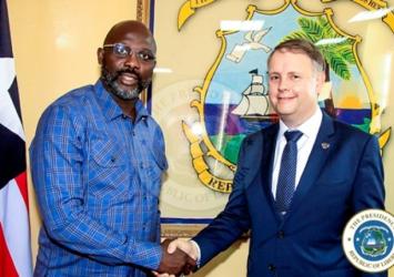 Pres. Weah, Mr. Palmer shake handsExecutive Mansion