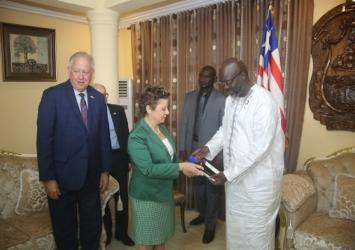 President George Weah shakes hand with Ambassador Christine ElderExecutive Mansion Photo