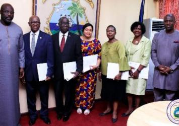 President Weah along with Commissioners, ambassadors and Deputy Foreign Minister Elais ShoniyinExecutive Mansion