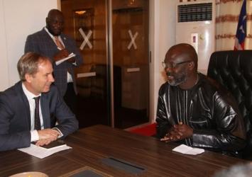President Weah chats with Ambassador Olof SkoogExecutive Mansion Photo