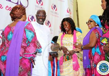 President Weah flanked by First Lady Clar Weah receiving 'He for She' Sheroes Award at the Sheroes Conference in MonroviaEXECUTIVE MANSION