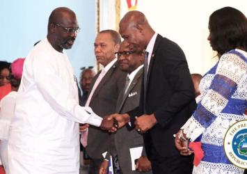 President Weah greets House Speaker Bhofal Chambers as First Lady looks on at the Independence Day Thanksgiving and Intercessory ServiceEXECUTIVE MANSION