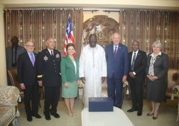 President Weah in a group photo with U.S. Delegation at his Rehab Community ResidenceExecutive Mansion Photo
