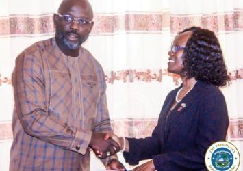 President Weah presents certificate of office to Amb Gurly Teta Gibson during her commissioning ceremony at the MOFAExecutive Mansion